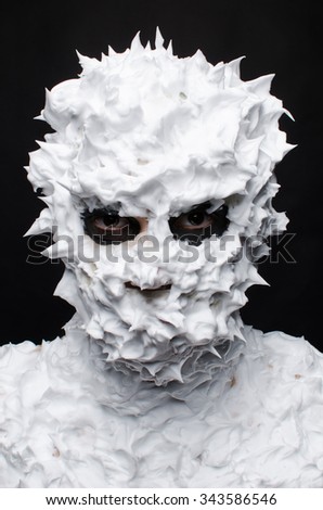 man  with shaving foam around head 
