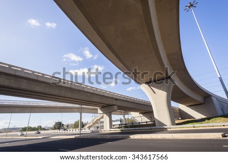 Highway Junction Flyover Ramps New Highway road junction inter section flyover ramps structures complete for vehicle traffic flow. Royalty-Free Stock Photo #343617566