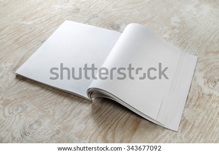 Photo. Blank magazine template on wood background with soft shadows. Template for graphic designers portfolios.