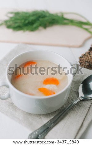 delicious cream soup with carrots and greens. Toned picture