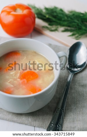 delicious cream soup with carrots and greens. Toned picture