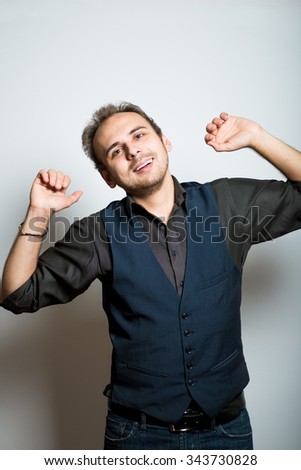 young business man stretching after work, manager, office style studio shot isolated on the gray background