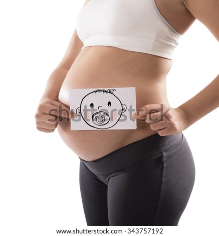 Pregnant woman holds card with baby face