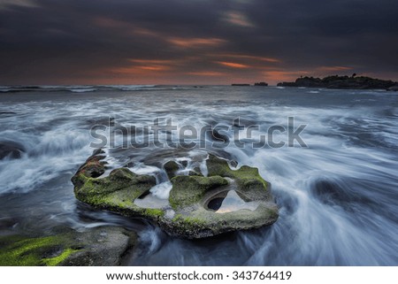 Sunset at Beach Mengening with Dramatic sky & motion of water . soft focus due long exposure