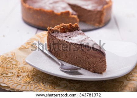 Chocolate mousse ice cream cake pie on rustic white background