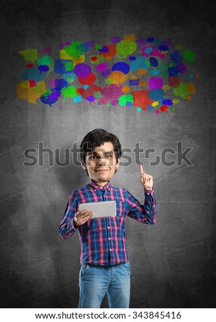 Funny bigheaded student with tablet in hands and colorful speech bubbles