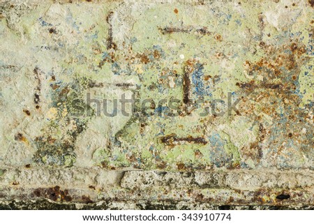 Dirty colorful green and blue steel plate with rust and moss and cement stains abstract background textures