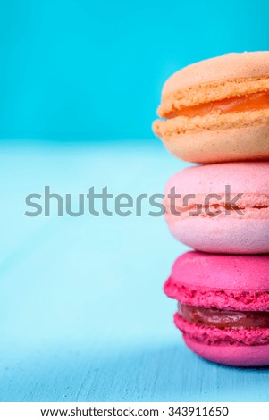 Colorful French Macaroons On Blue Background