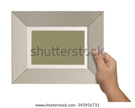 man's hand holding a wooden box isolated on white background. close up