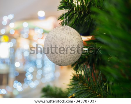 White Christmas ball on Christmas tree, selective focus