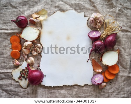 Food vintage health mock up cut onions, red, onion, garlic, carrot, pepper on baked burn paper on linen background
