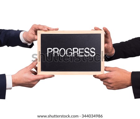 Two man holding mini blackboard with PROGRESS message