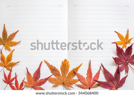 Blank note book paper texture line pattern background for handwriting with colorful autumn leaves frame
