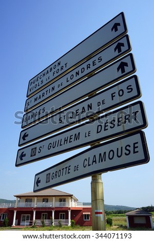ANIANE, FRANCE - CIRCA JULY 2015 Road signs near house                               