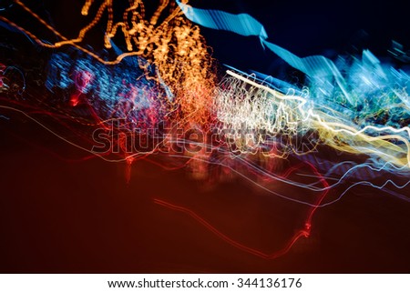 Photograph of some blurred lights on a night urban scene