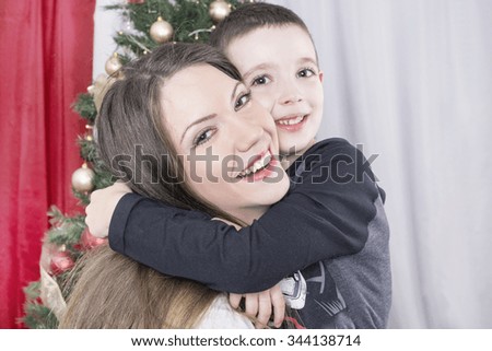Mother and child hugging on Christmas