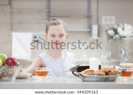 teenager at breakfast in the kitchen