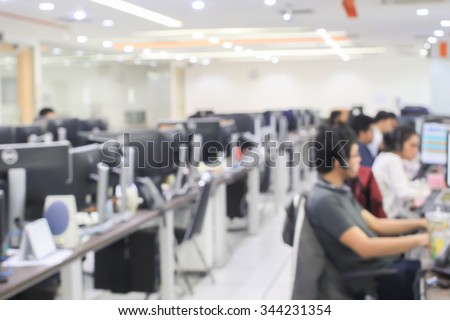 blurred of employee working call centre hotline at office computer indoor room concept. Royalty-Free Stock Photo #344231354