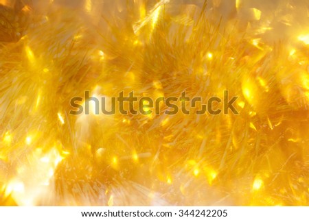 Soft golden Christmas lights - festive bokeh background. Abstract golden background