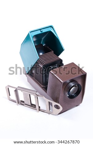 Vintage filmstrip projector on the white background. Old projector for displaying of slides.