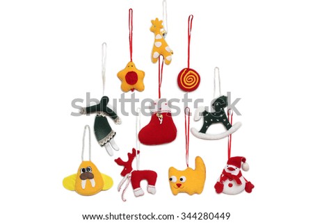 New Year Tree formed with handmade Christmas toys over white background, winter holidays symbol