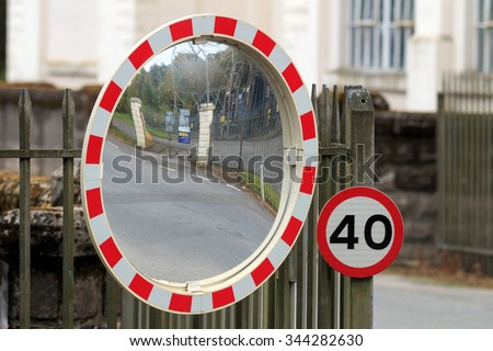 40 mph sign and road traffic safety mirror 
