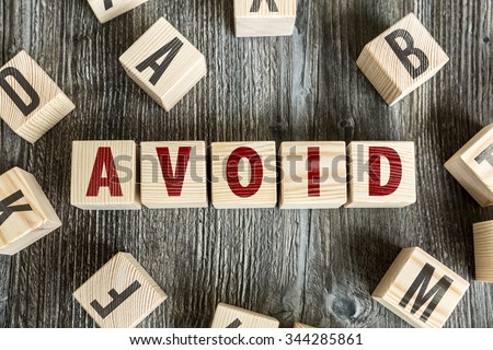 Wooden Blocks with the text: Avoid Royalty-Free Stock Photo #344285861