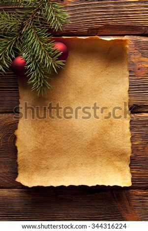 Christmas background - blank paper sheet and branch of spruce tree