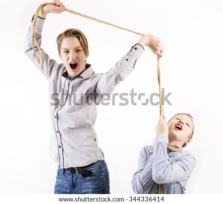 Young boy chocking another boy with a rope isolated on white background.