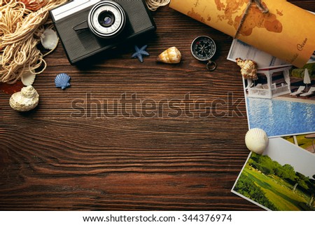 Beautiful composition with sea accessories and camera on table close up