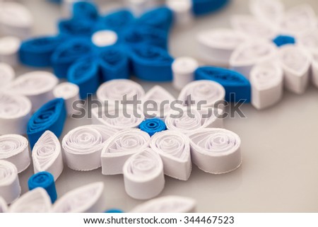 Paper snowflakes made with quilling technique - macro details