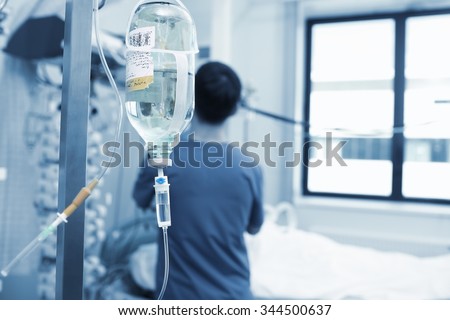 Physician works with critically ill patient in hospital Royalty-Free Stock Photo #344500637