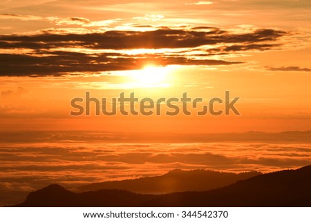 Beautiful sunset at the mountains. Colorful landscape with sun and 