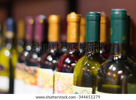 Wine bottles in the wine store. Royalty-Free Stock Photo #344651279