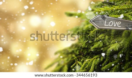 Love wooden sign, snowflakes and new year tree. Christmas lights bokeh background. Happy New Year and Merry Christmas design banner background.