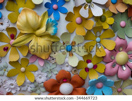 various colorful plastic flower decorate on wall, look like fantasy world.