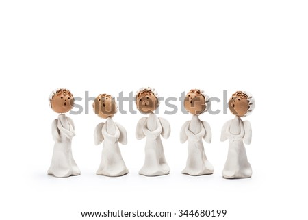 Christmas carolers. Angelic figurines on white background 