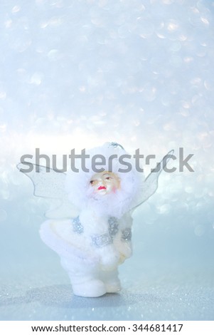 Christmas decoration angel on a silver background