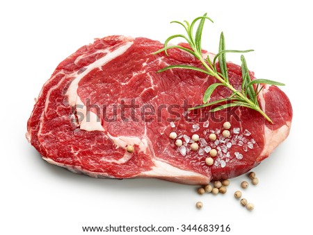 fresh raw beef steak with spices isolated on white background, top view Royalty-Free Stock Photo #344683916