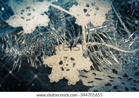 Christmas decor: snowflake related crochet Christmas tree with reflections and texture.