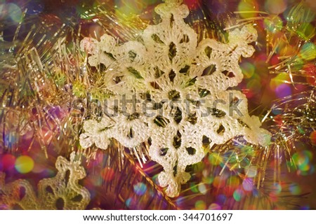 Christmas decor: snowflake related crochet Christmas tree with reflections and texture.
