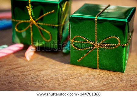 Beautiful small gift boxes on wooden board 