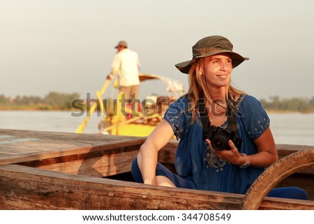 woman on a boat-irrawaddy Royalty-Free Stock Photo #344708549