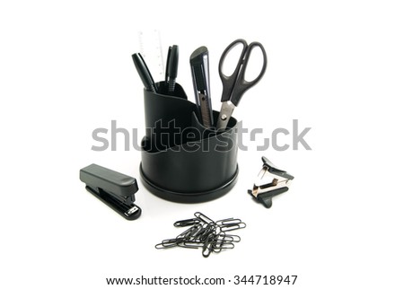 paper clips and other office stationery on white 