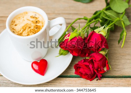 Valentines day decoration with cup of coffee with heart on rustic background