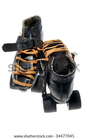 This is a pair of old dirty black roller skates (roller skates) with orange laces.  Zoom in to see the details of wear.  Isolated on a white background.