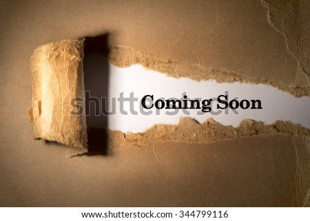 Torn paper box with word coming soon in low light Royalty-Free Stock Photo #344799116