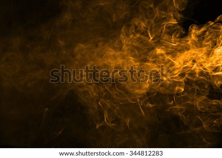 Orange movement of smoke texture on black background