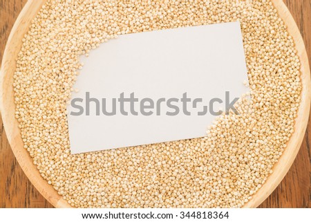 Organic quinoa grain and business card, stock photo