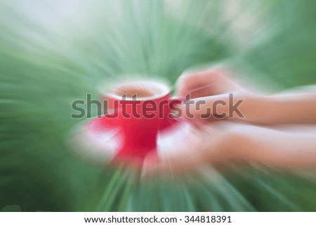 Woman serve red cup of coffee, stock photo